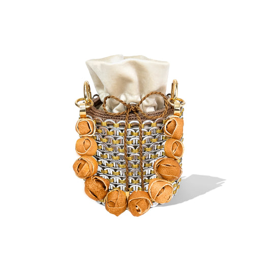 Side profile of the Louis Mini Bucket showcasing its structured cylindrical shape, orange-toned wooden beads, and metallic netting.