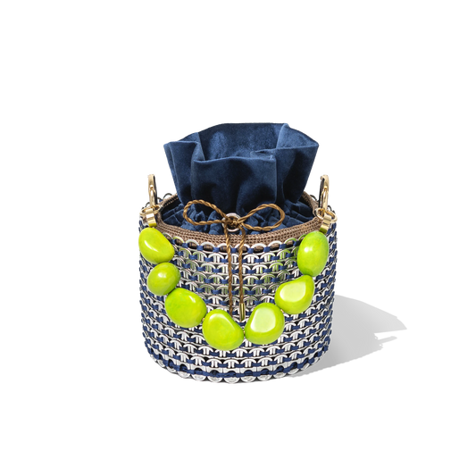 Top view of the Leonard Bucket Bag showcasing the contrast between the deep navy pouch and the vivid green crystal detailing around the rim.