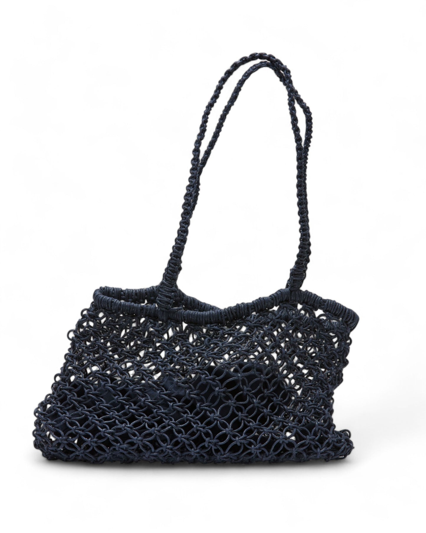 Side profile of the Sapphire Moon Clutch showing its intricate open-weave crochet detailing and generous interior space.