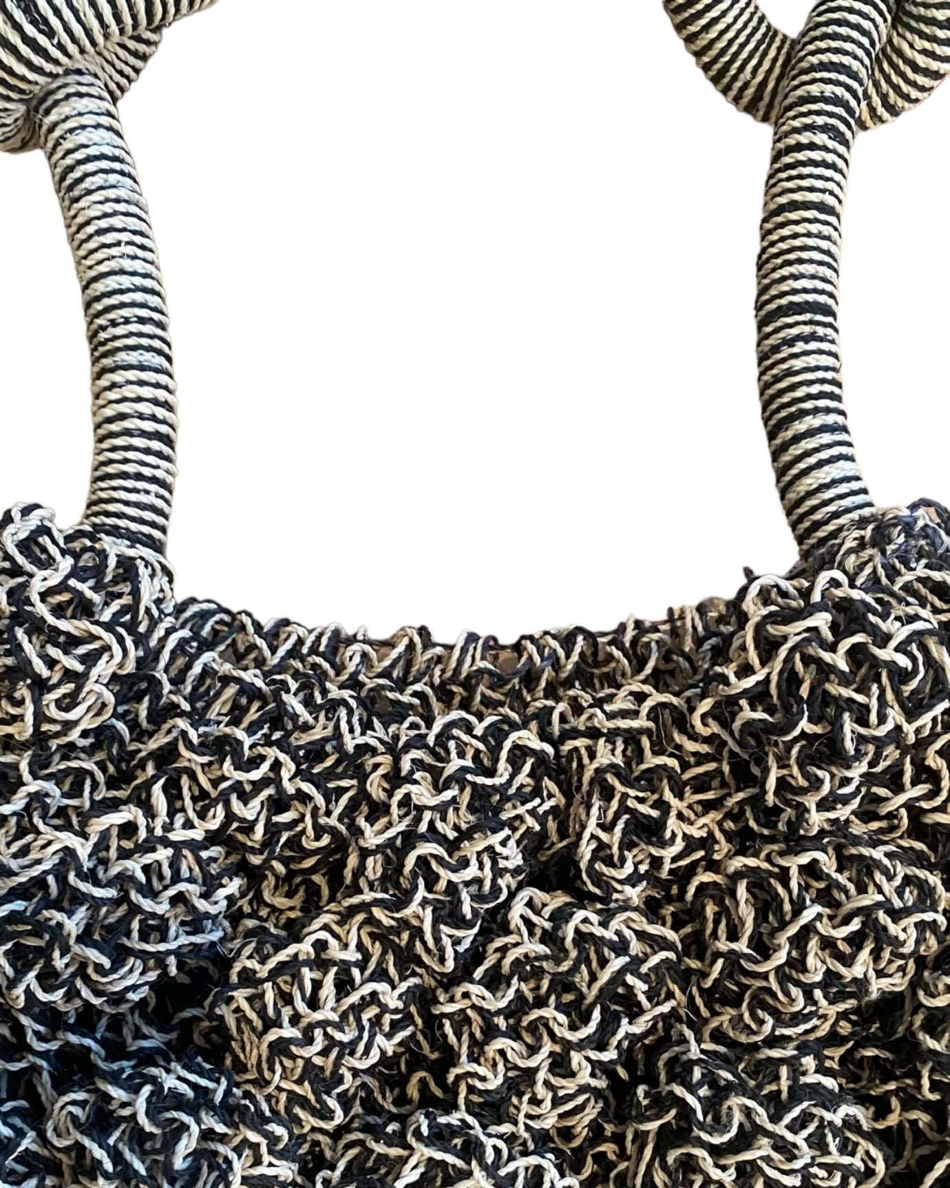 Close-up of the grey Ameba Mesh Bag catching natural sunlight, highlighting texture and craftsmanship.