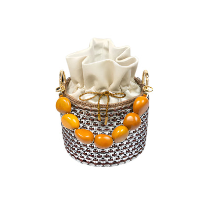 Top-down view of the Alex Bucket Bag revealing the gathered cream pouch and golden beads arranged in a semi-circular handle.