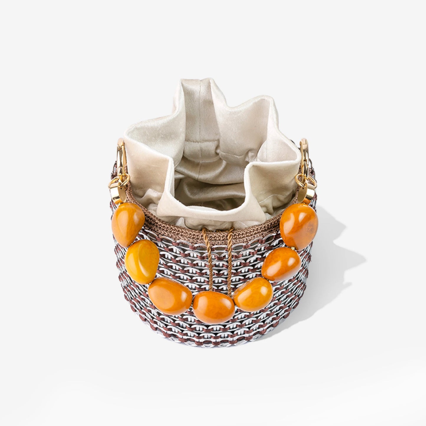 Rear view of the Alex Bucket Bag featuring crystal mesh texture, bold beaded handle, and a peek of the internal drawstring pouch closure.