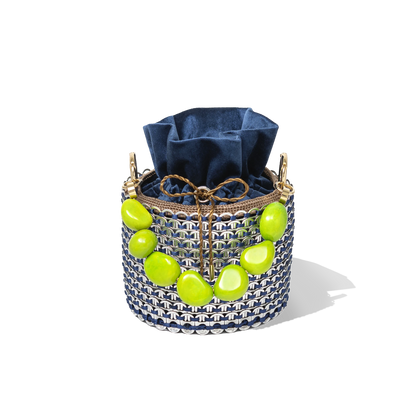 Top view of the Leonard Bucket Bag showcasing the contrast between the deep navy pouch and the vivid green crystal detailing around the rim.