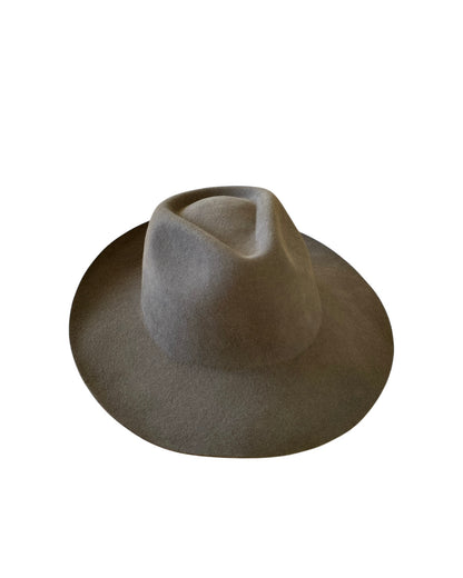 Top-down perspective of the Shiitake fedora hat emphasizing the earthy wool-felt finish and bold green band encircling the crown.