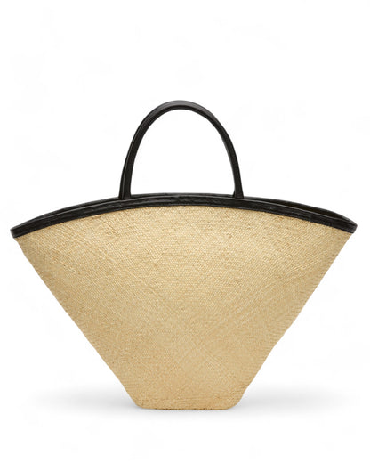 Angled view of the Seashell Mini Tote highlighting its geometric fan shape and sturdy black handles against a clean background.