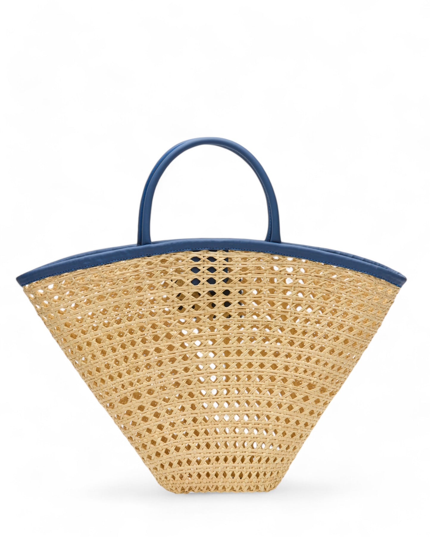 Angled view of the Seashell Tote, emphasising its spacious interior and contemporary blend of straw and eco-leather materials.