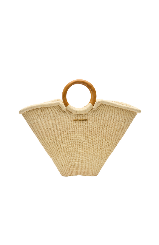 Front-facing flat lay of the Verano Tote by My Paloma, handcrafted from natural toquilla straw with two circular wooden handles and a wide trapezoidal silhouette.