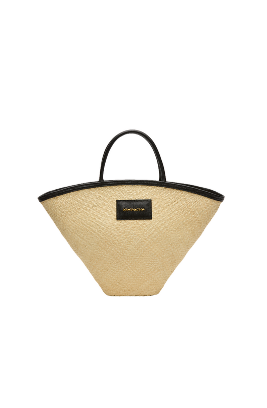 Seashell Mini Tote in natural toquilla straw with a structured silhouette, black eco-leather trim, and dual top handles, shown on a white background.