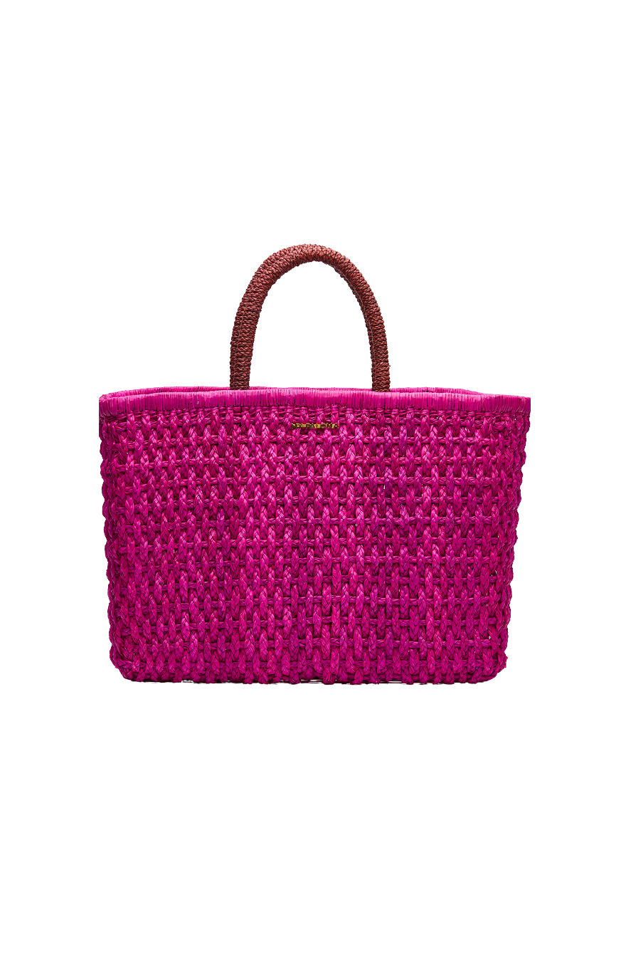 Front-facing flat lay of the Viva Tote, handwoven in bright magenta toquilla straw with dual dark currant handles and a structured rectangular shape.