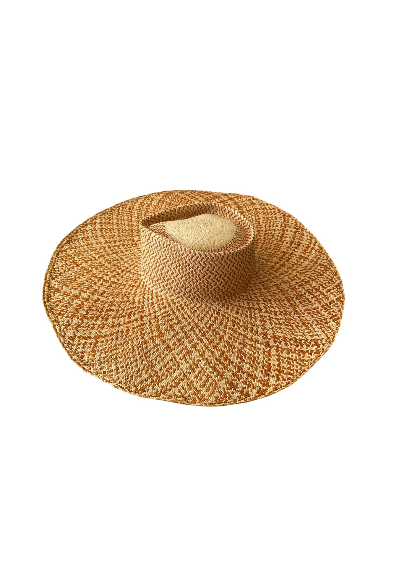 Top-down view of the Chalan Sunhat in Copper Beige, showcasing its wide-brimmed silhouette and handwoven two-tone straw pattern in warm ochre and ivory hues—designed for elegant sun protection.