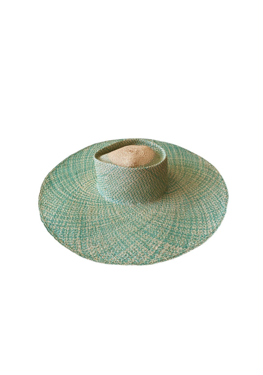Top-down view of the Chalan Sunhat in Surf Marino showing the wide circular brim and central dome in natural palm fibre—blended with turquoise weave for a coastal-luxe aesthetic.