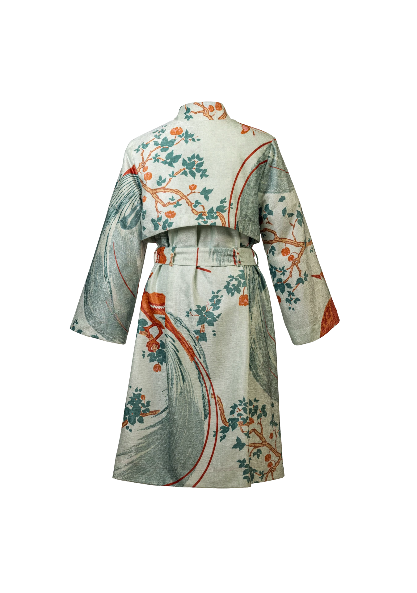 Rear image of the Exotic Birds Coat in soft sage tones and botanical print, shot in Buenos Aires, Argentina – artisan-made outerwear by My Paloma.