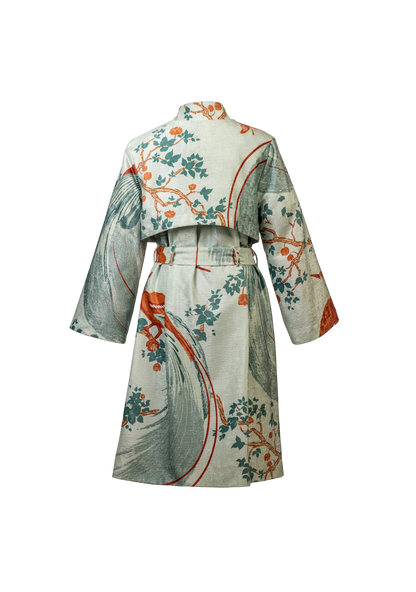 Rear image of the Exotic Birds Coat in soft sage tones and botanical print, shot in Buenos Aires, Argentina – artisan-made outerwear by My Paloma.