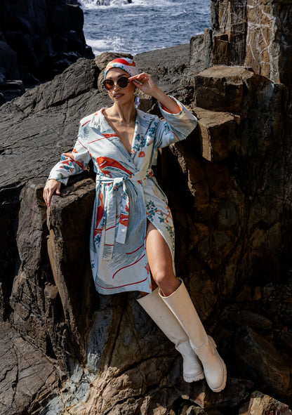 Model wearing the Exotic Birds Coat with rust and mint illustrations, photographed in Amsterdam, Netherlands – cross-cultural fashion by My Paloma.  