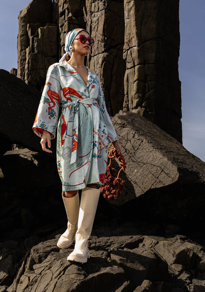 The Florence Broadhurst Exotic Birds Coat in soft sage tones and botanical print, shot in Buenos Aires, Argentina – artisan-made outerwear by My Paloma.