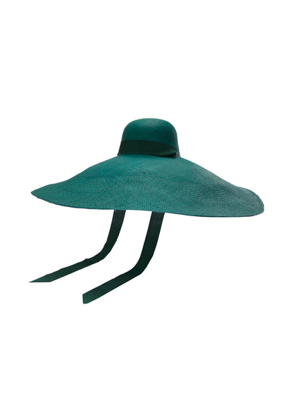 Lady Ibiza Hat in deep green, shown in a front-facing flat lay with wide, undulating brim and structured dome crown, accented by long ribbon ties—crafted for high-impact sunwear style.