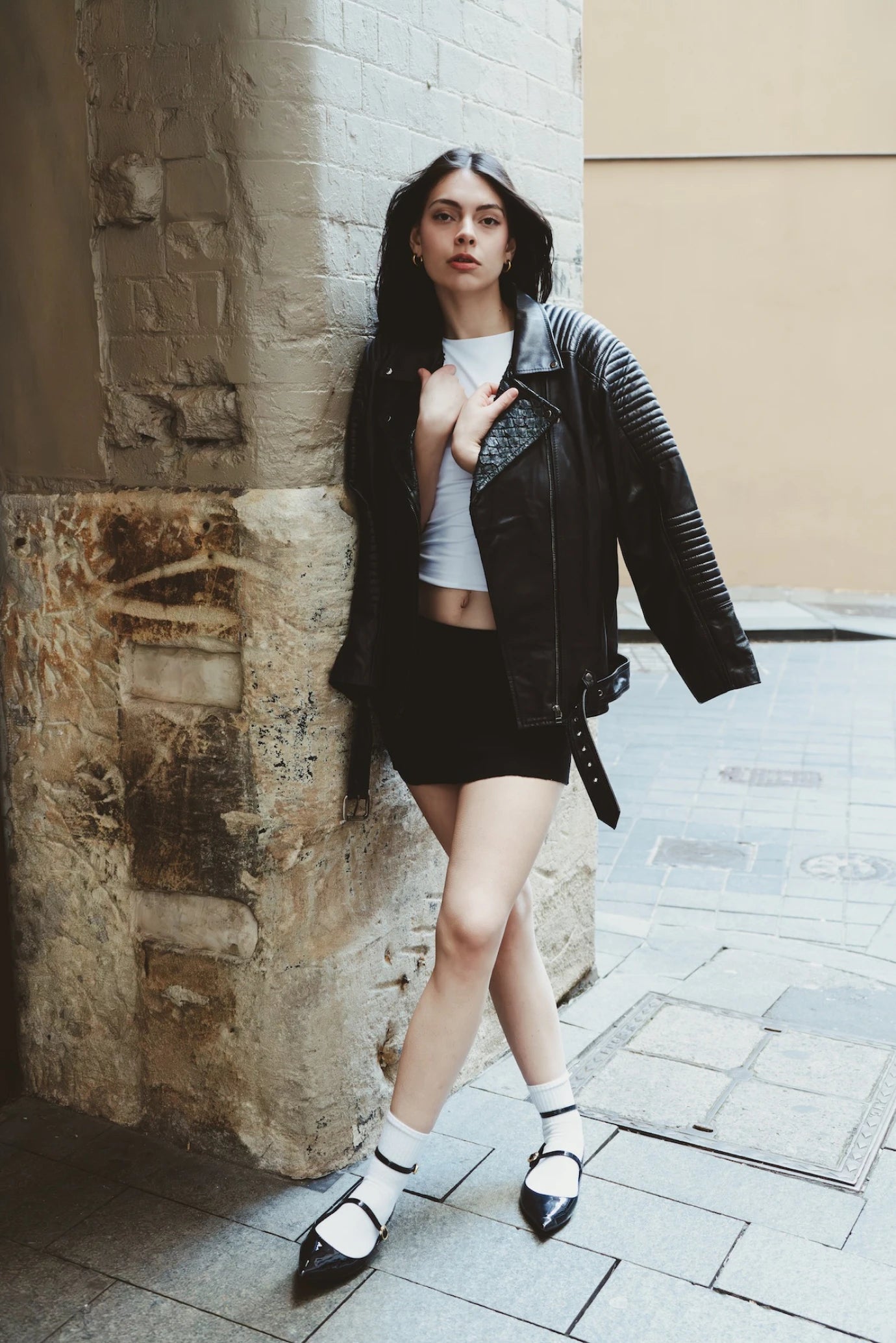 Girl wearing Qara Jacket in black eco leather with quilted panel detail, photographed in Melbourne, Australia – sustainable statement outerwear by My Paloma.