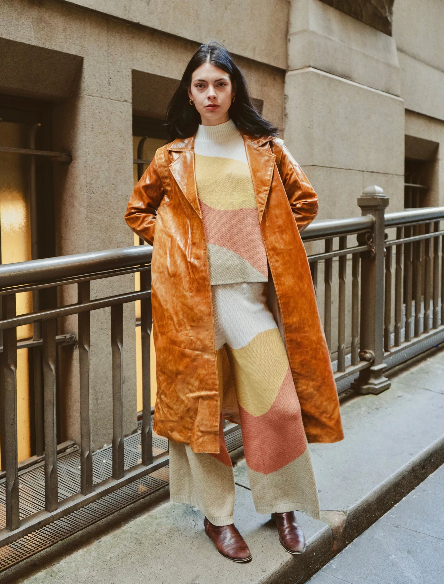 Girl wearing he Sauce Coat with minimalist cut and warm caramel hue paired with luxurious leisure wear, photographed in Paris, France – a slow fashion essential from My Paloma