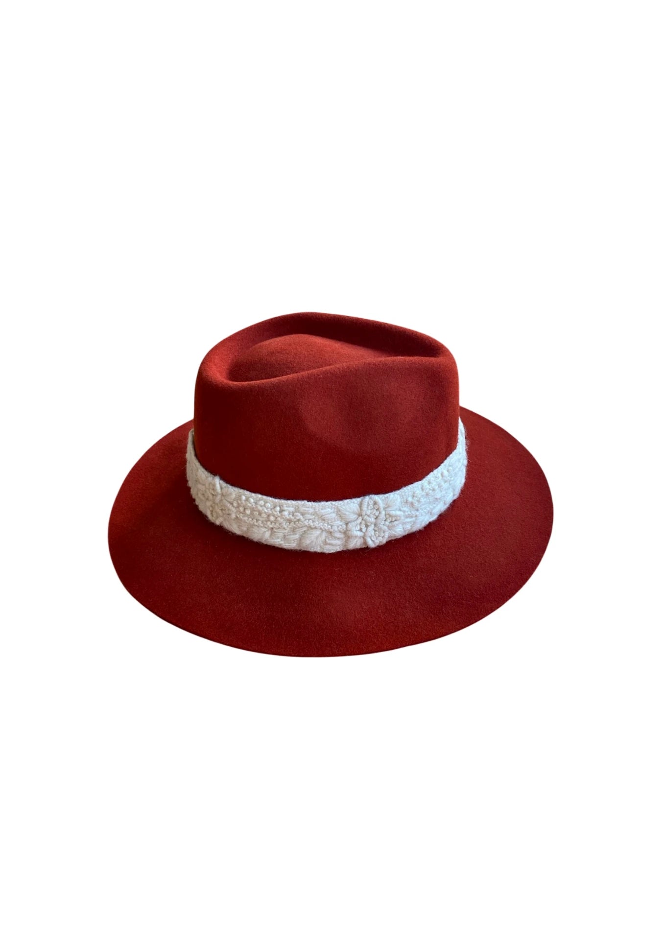 Back angle of a brick red wool-felt fedora hat with a cream embroidered band, set against a white background.