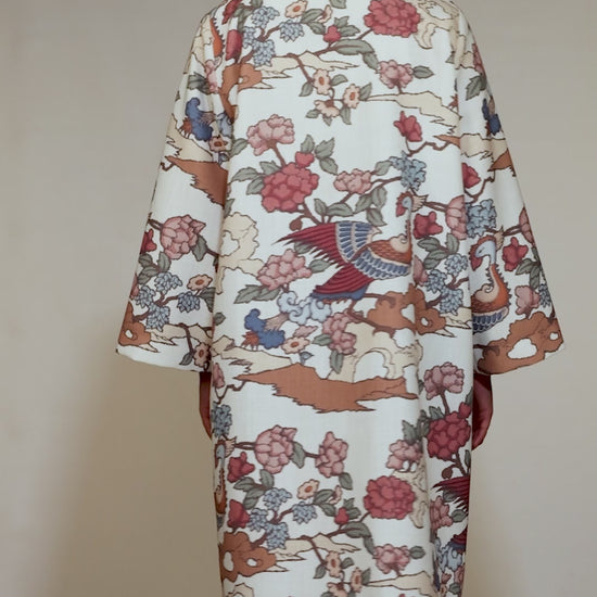 Front of the Phoenix Kimono with peach and green bird motifs, photographed in Lisbon, Portugal – cultural craftsmanship by My Paloma.

