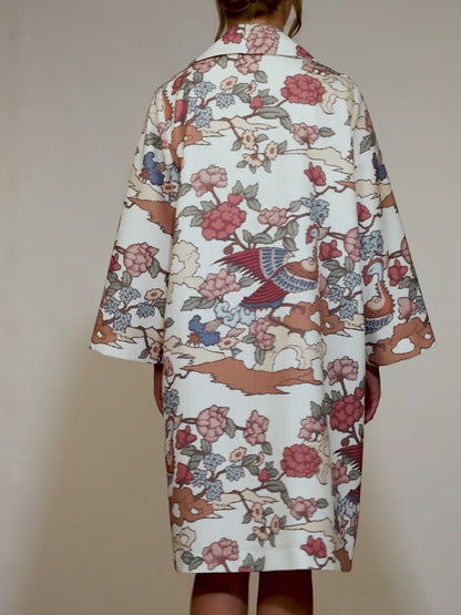 Front of the Phoenix Kimono with peach and green bird motifs, photographed in Lisbon, Portugal – cultural craftsmanship by My Paloma.

