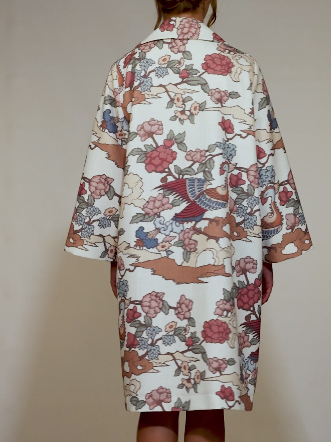 Front of the Phoenix Kimono with peach and green bird motifs, photographed in Lisbon, Portugal – cultural craftsmanship by My Paloma.

